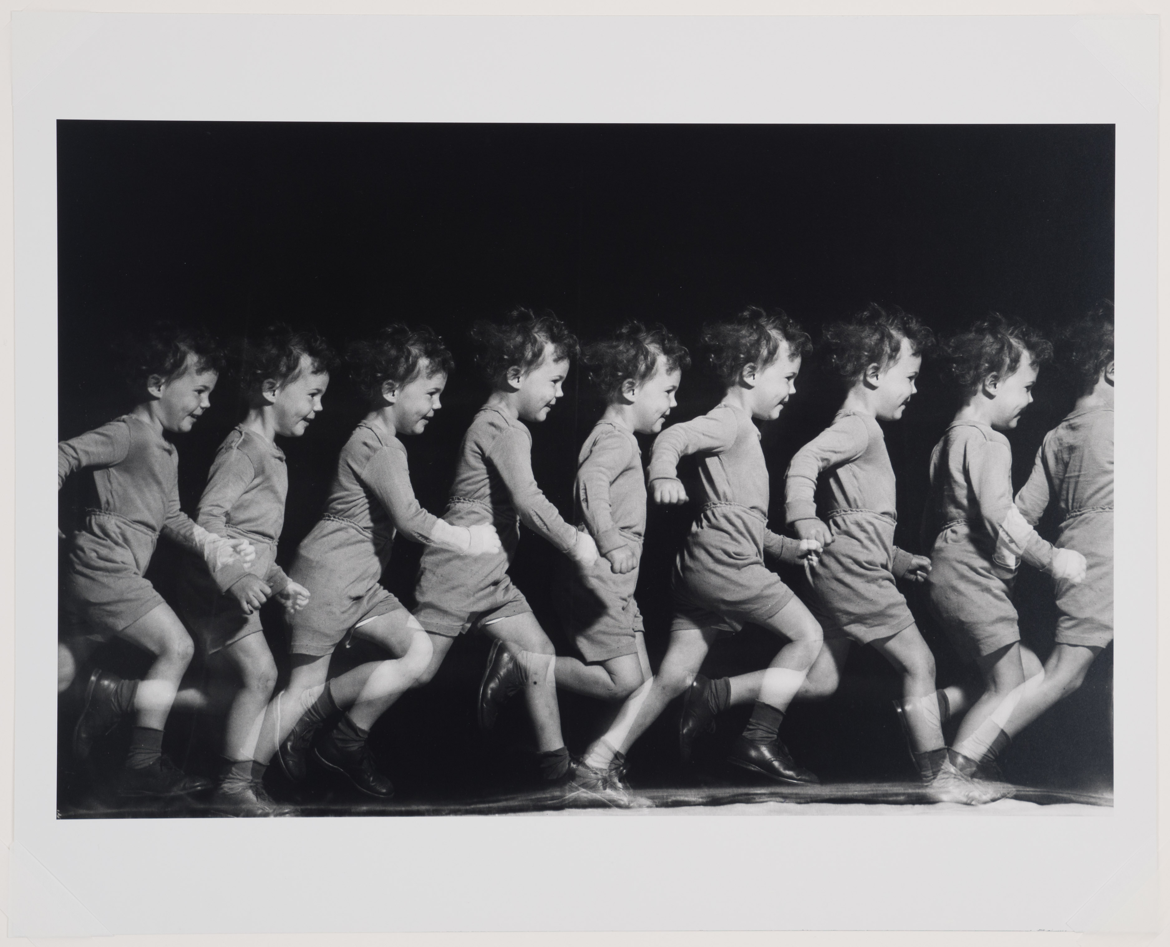 Boy runs across the image, many scenes of his run shown