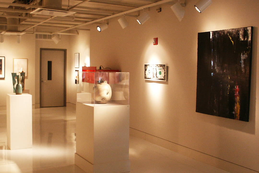 Painting, sculpture, and ceramics installed in a gallery