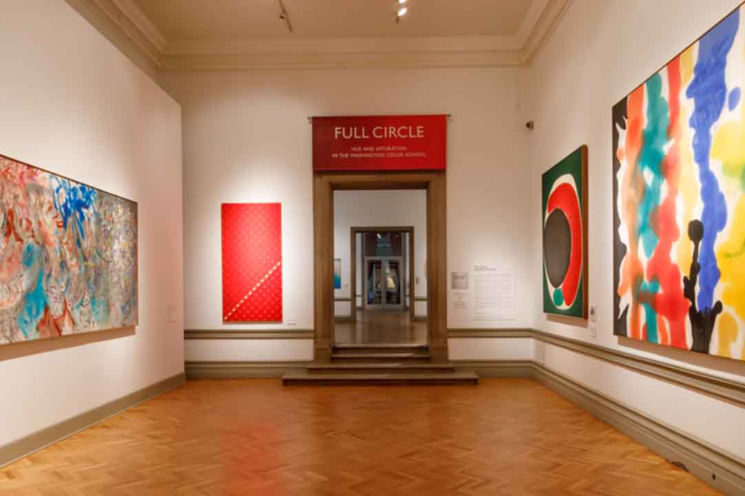 Large colorful paintings installed in the Corcoran Flagg Building