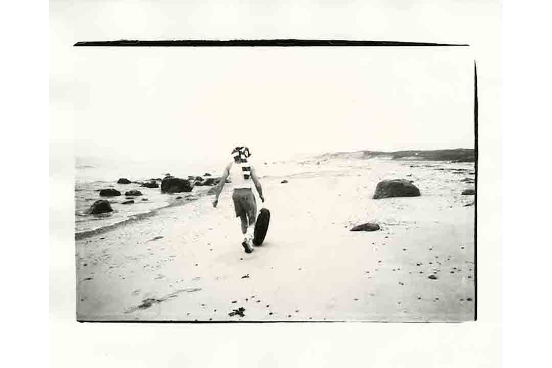 image of man smiling on beach