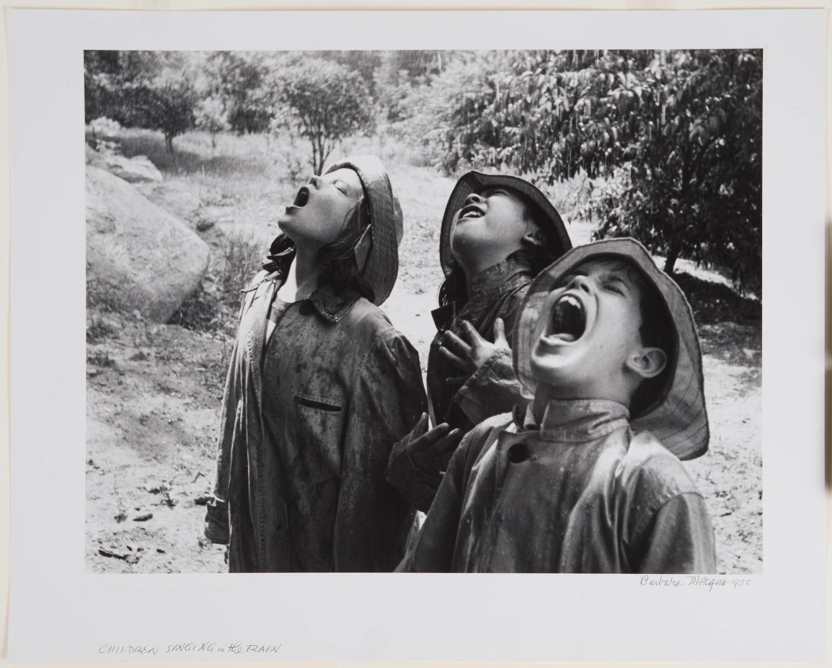 Barbara Morgan black and white photograph of three children in the rain with their mouths open [link goes to collection database entry]