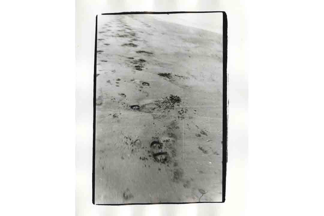 photograph of footsteps in sand