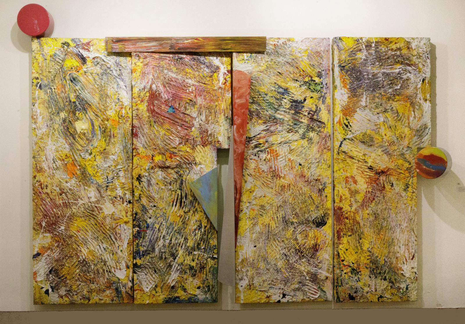 Sam Gilliam abstract painting titled Uguisu.  Yellow with many colors and red pieces attached. [link goes to collection database entry]